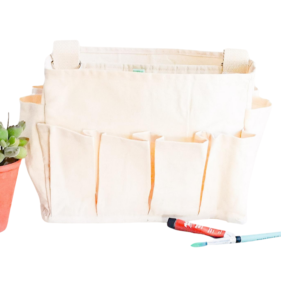 Craft Caddy with multiple inner & outer pockets, carry handle & adjustable webbing carry sling. Made with natural white cotton canvas.