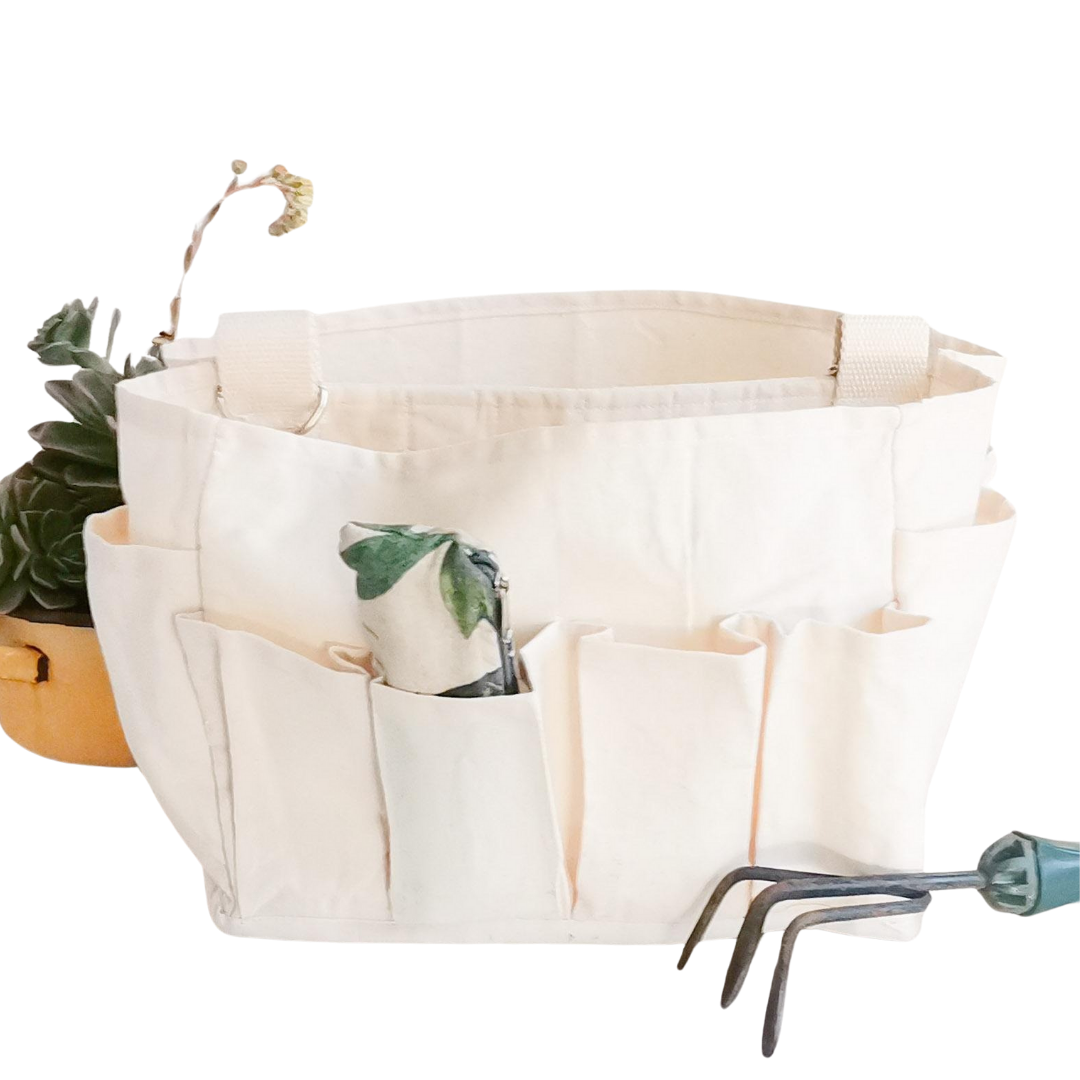 Craft Caddy with multiple inner & outer pockets, carry handle & adjustable webbing carry sling. Made with natural white cotton canvas.