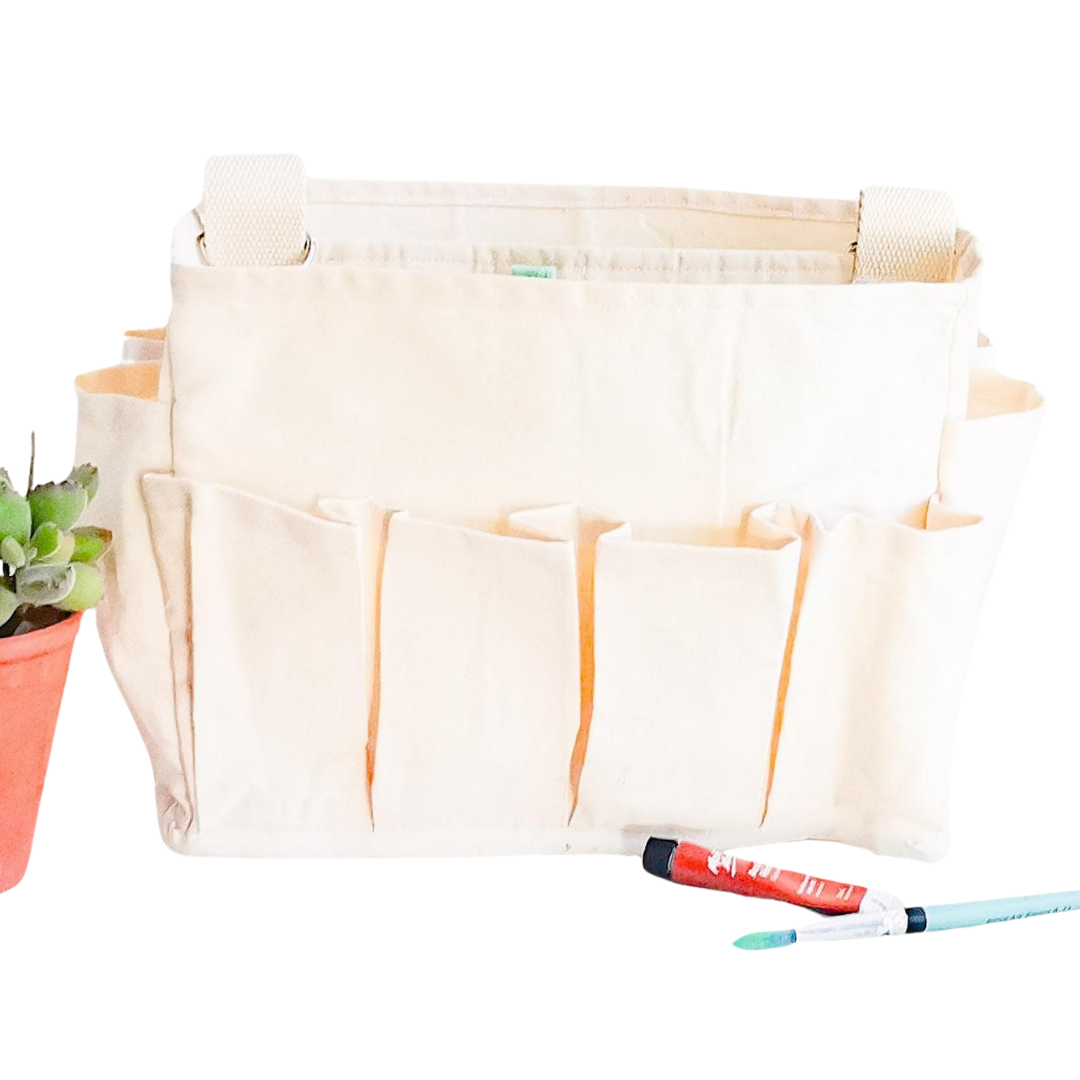 Craft Caddy with multiple inner & outer pockets, carry handle & adjustable webbing carry sling. Made with natural white cotton canvas. 