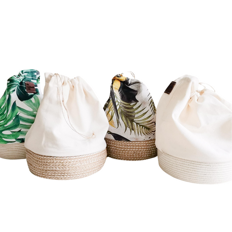 Drawstring Basket bags used for packaging. Jute rope, cotton rope as bases. Botanical or white fabric as tops. Group photo