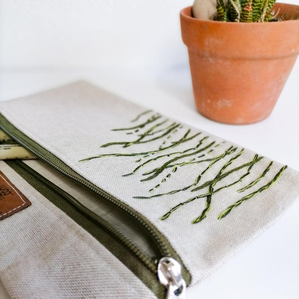  green wavy lines depicting grass on linen zipper pouch
